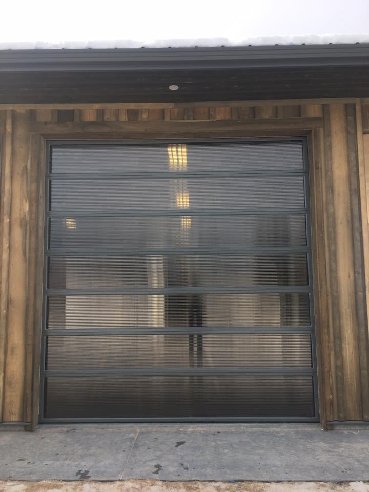 Modern glass garage door with unique frames
