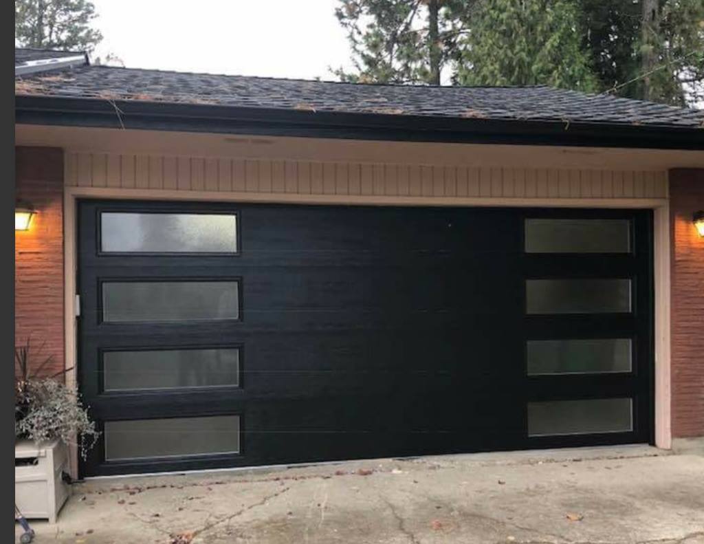 Modern black garage door with windows on both sides 