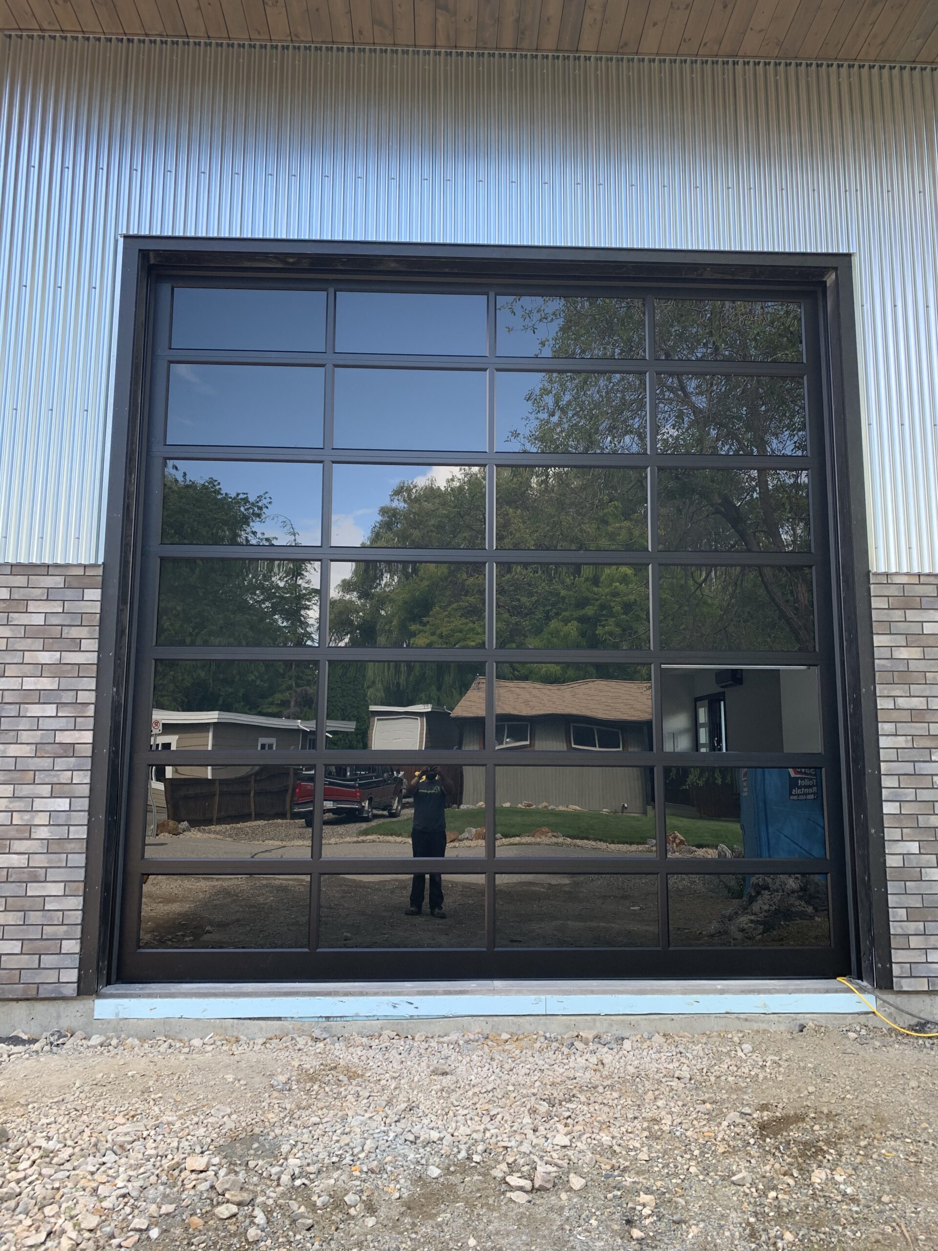 Modern glass garage door with black frame