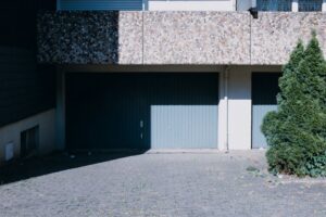 modern garage door overlooking Okanagan vineyard landscape - how okanagan weather affects your garage door