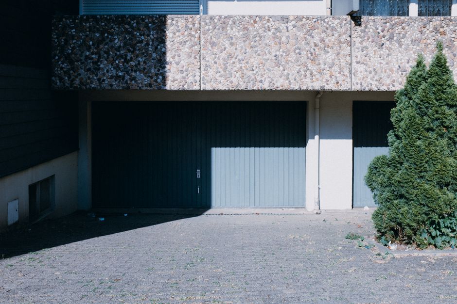 modern garage door overlooking Okanagan vineyard landscape - how okanagan weather affects your garage door