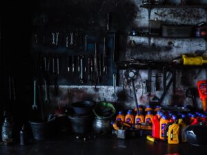 spring cleaning and lubricating a garage door with seasonal maintenance