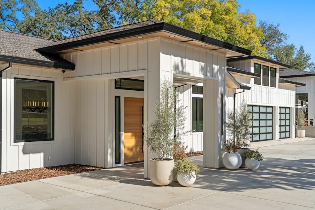luxury modern garage door on a beautiful home exterior - how a new garage door increases home value