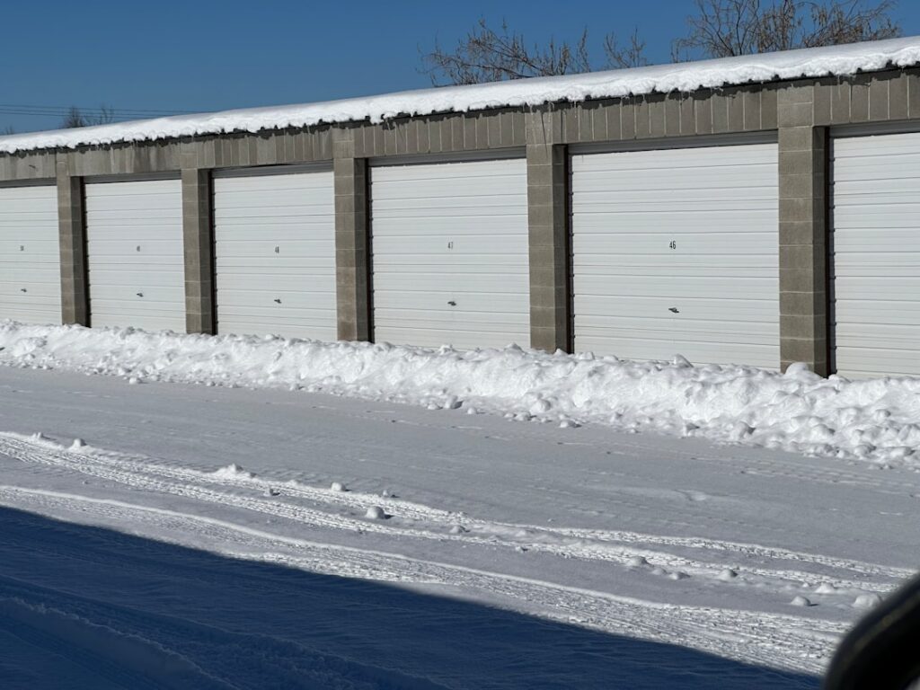 snow-covered garage door in winter with ice buildup