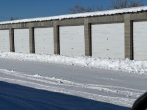 snow-covered garage door in winter with ice buildup