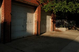 garage door exposed to summer sun and winter frost with temperature swings