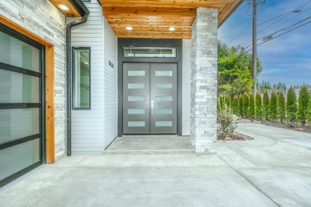 modern residential garage door with visible wear and curb appeal